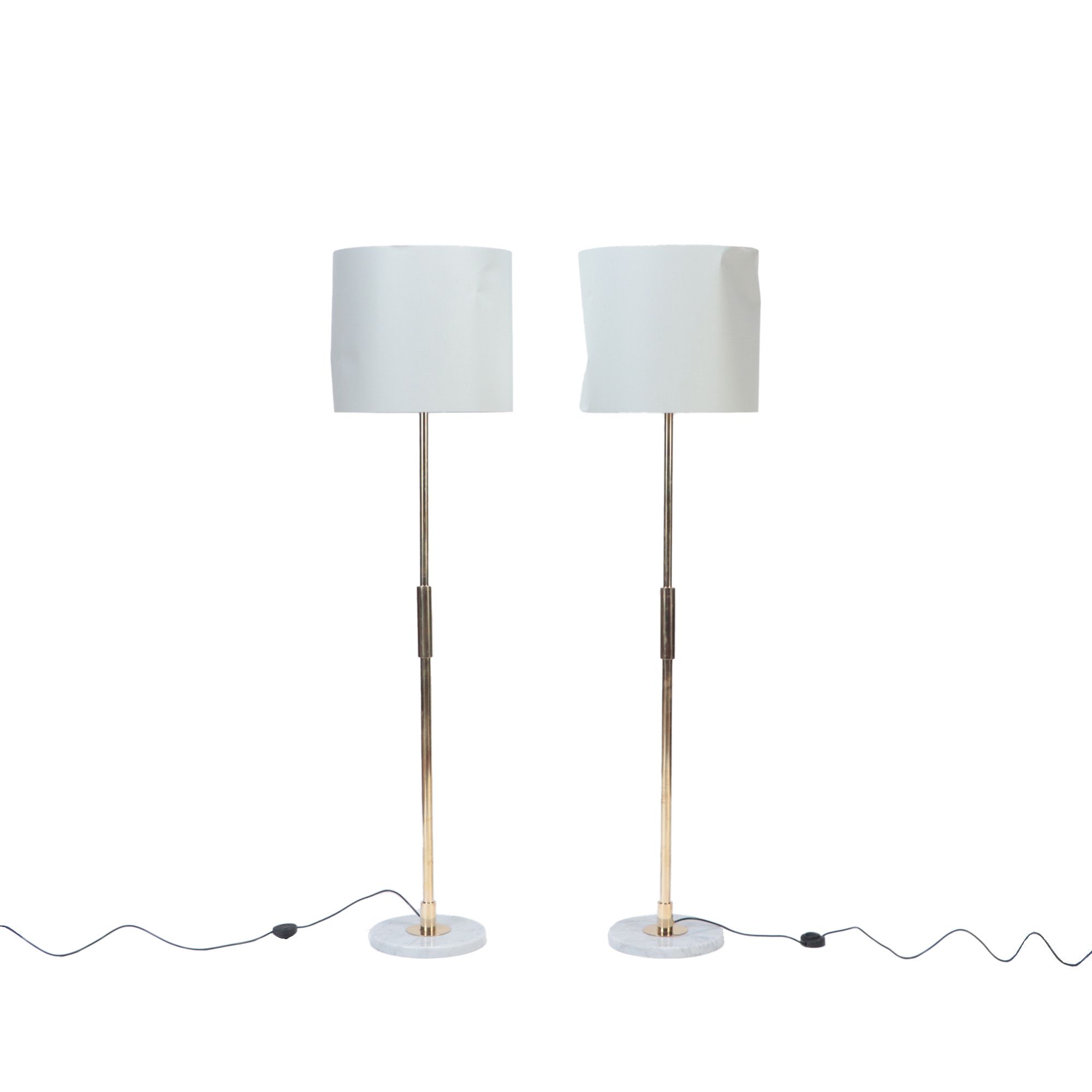 A pair of Italian Mid Century Modern brass floor lamps, circa 1950.