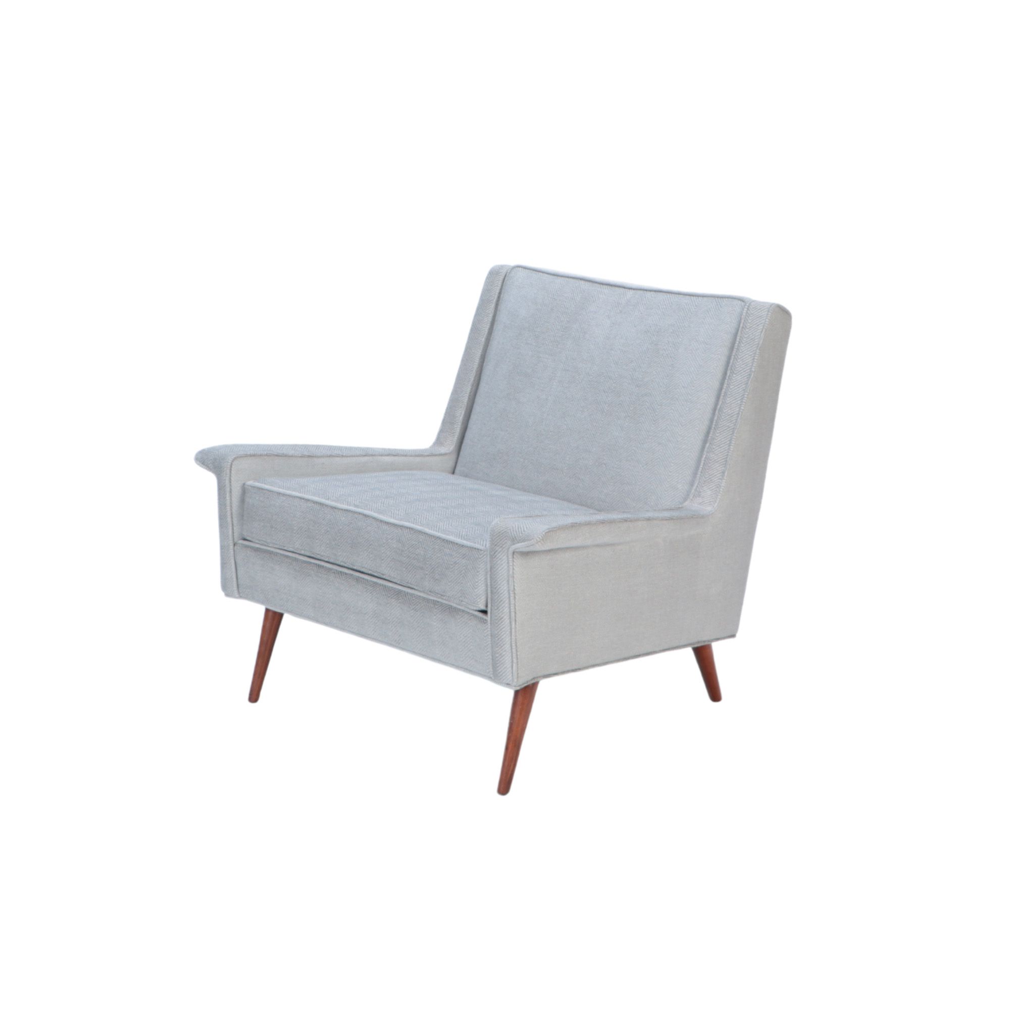 A Mid Century Modern newly upholstered lounge chair, in the style of Paul McCobb, circa 1950