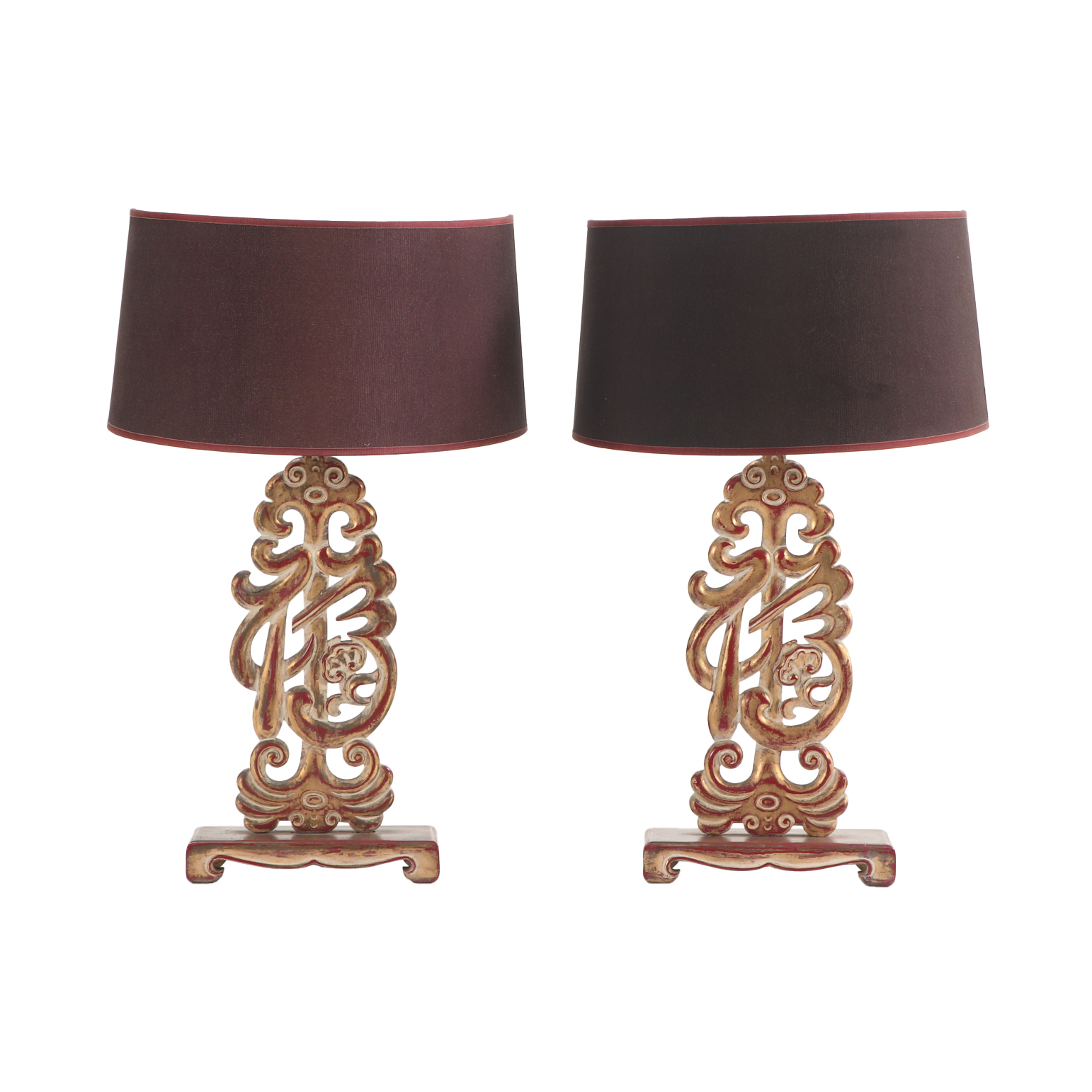 A pair of carved table lamps in the manner of James Mont, C. 1950.
