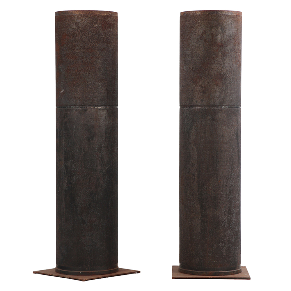 A pair of dimpled iron industrial tubes (fitted as lamps).