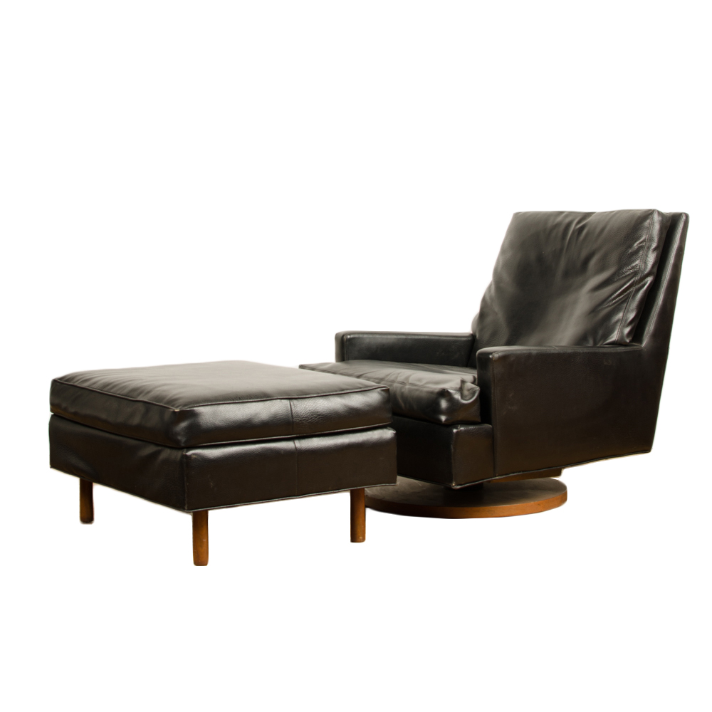 A mid century modern black leather reclining lounge chair with ottoman designed by Milo Baughman for James Inc.  Articulate Seating.