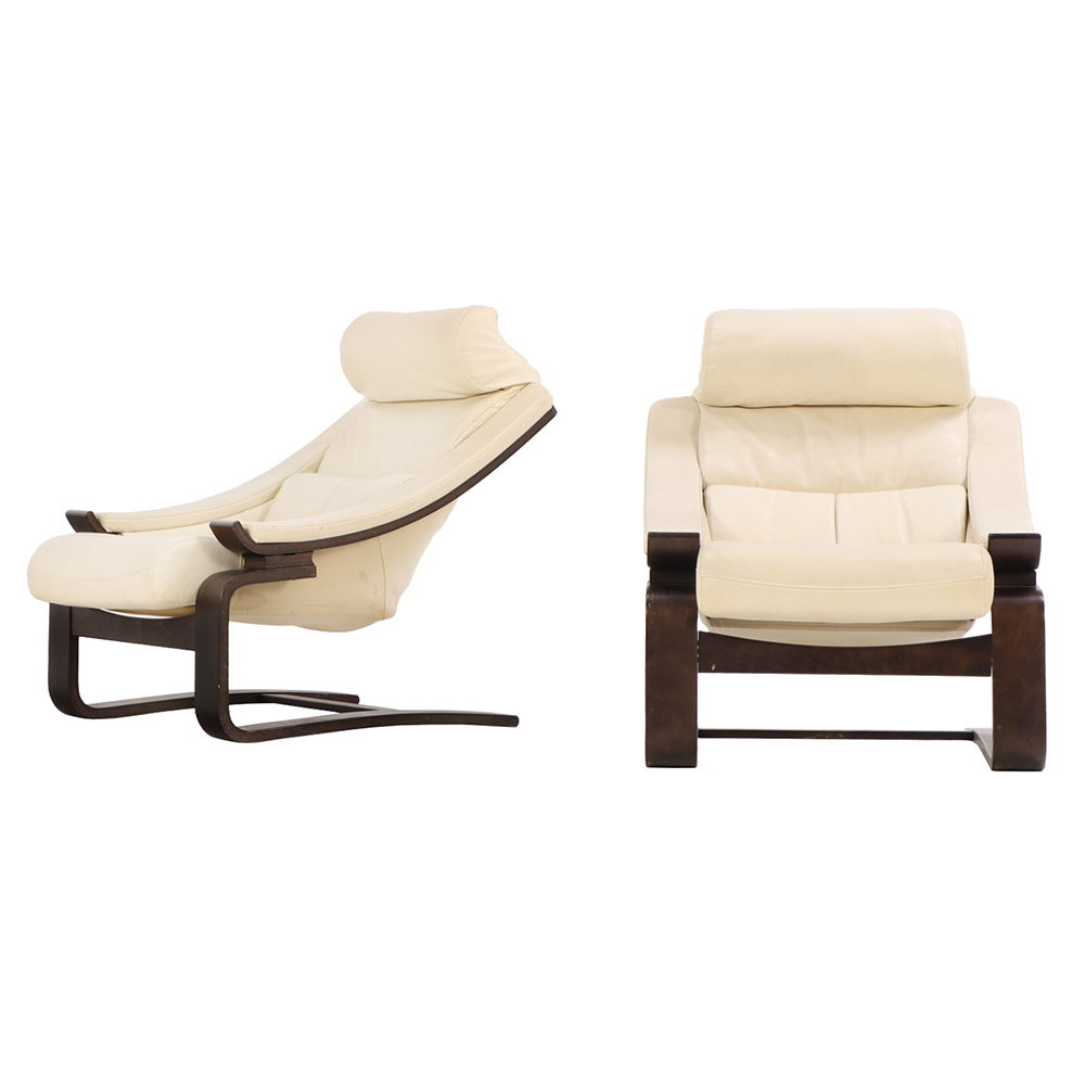 A Pair of French White Leather Cantilevered Lounge Chairs, C. 1970, Labeled Roche Bobois.