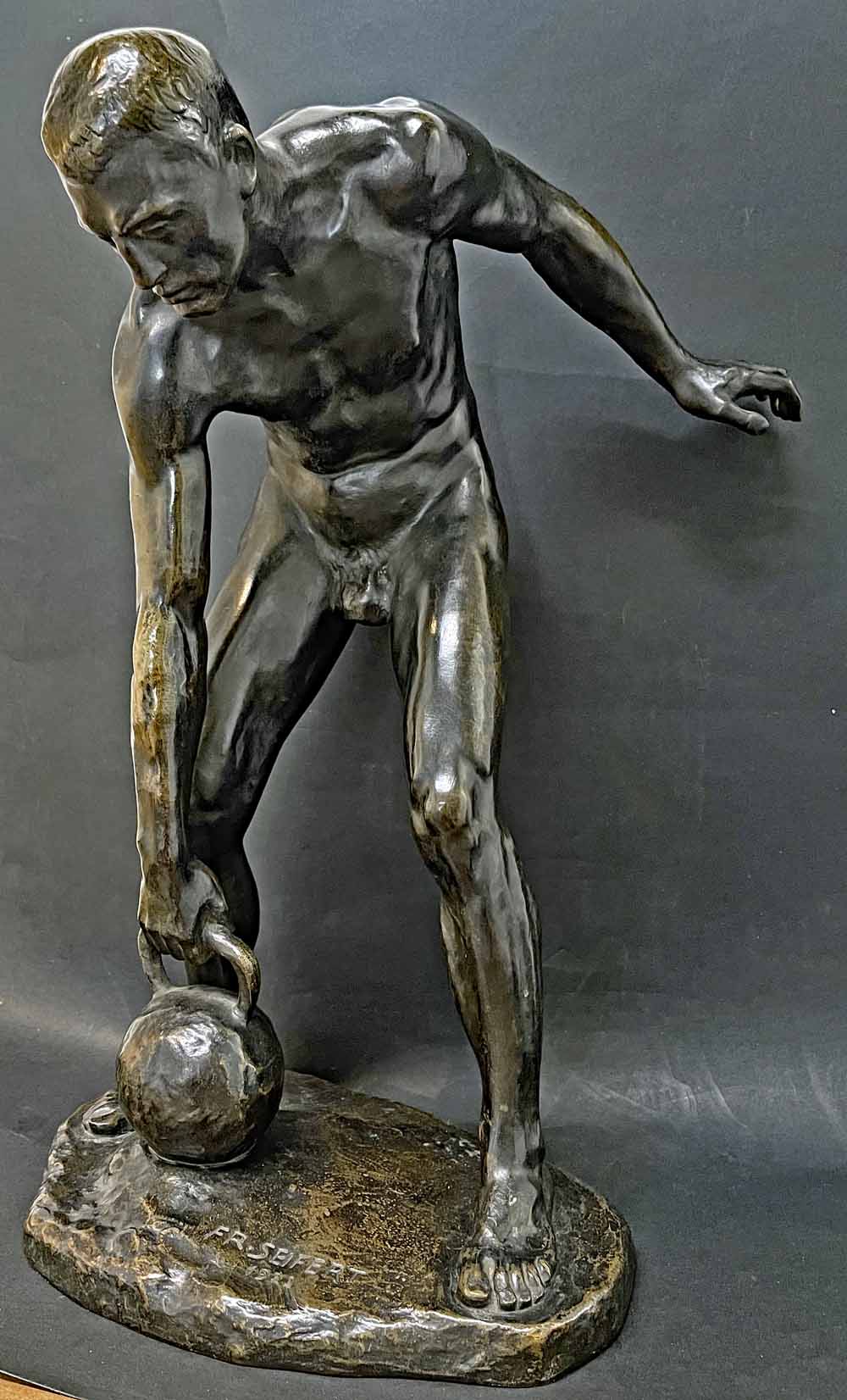 Bronze, Male Athlete with Kettlebell, by Franz Seifert.