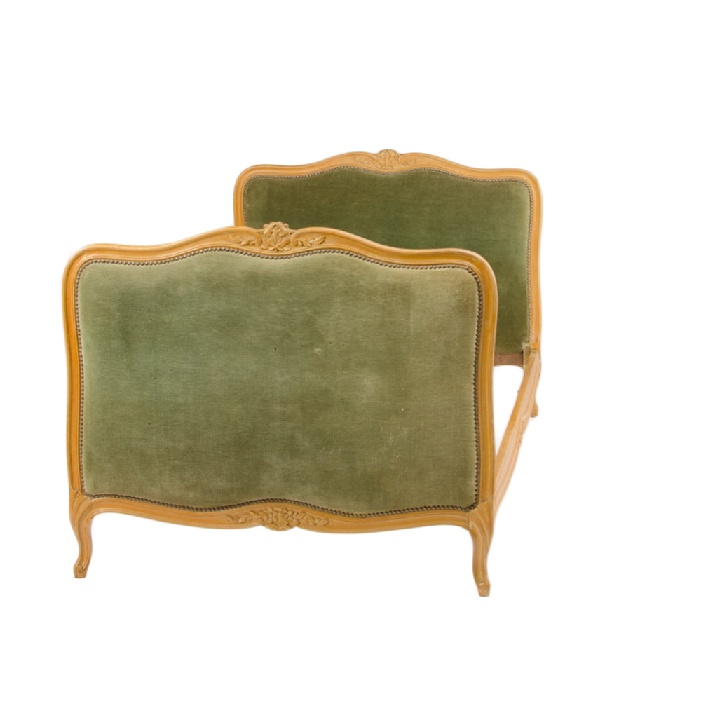 A French Louis XV style day bed with green velvet upholstered headboard and footboard circa 1930.