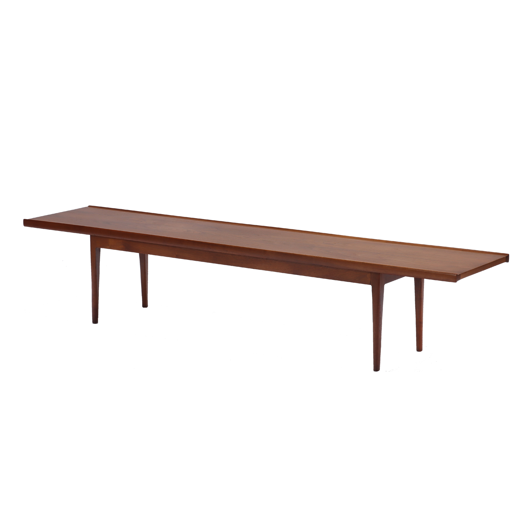 A Modernist Kipp Steward bench table in walnut, circa 1950.