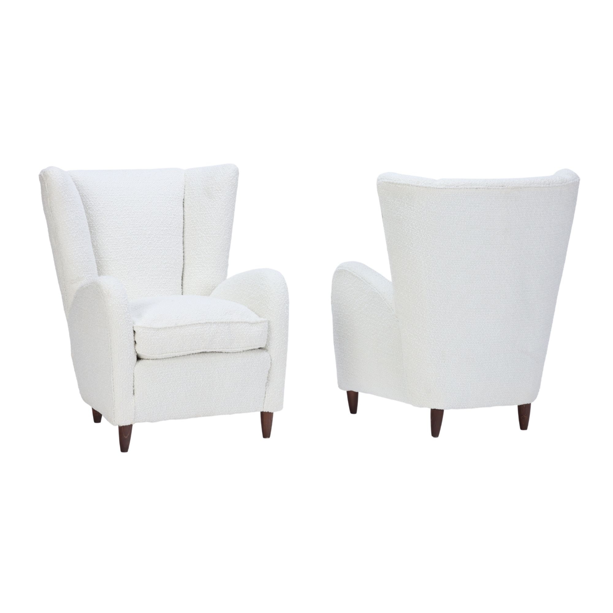 A pair of Italian Mid-Century Modern wing back lounge chairs by P.Buffa, circa 1950. 