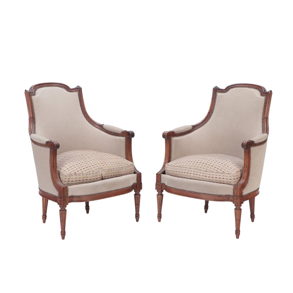 A Pair of Louis XVI Walnut Bergeres